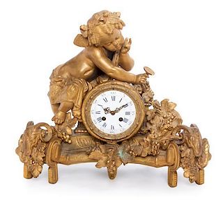 * A French Gilt Metal Figural Mantel Clock Width 19 inches.