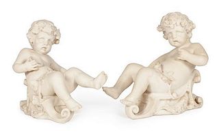 * A Pair of Cast Figures of Bacchic Putti Height 21 inches.