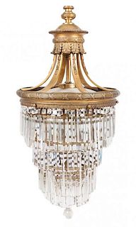 * A Neoclassical Giltmetal Chandelier Height 50 inches.