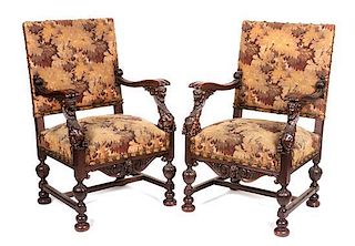 * A Pair of Victorian Carved Oak Open Armchairs Height 41 1/4 inches.