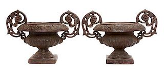 * A Pair of Victorian Style Cast Iron Urns Width over handles 17 inches.