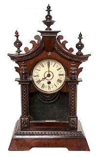 * A Victorian Walnut Bracket Clock Height 18 3/4 inches.