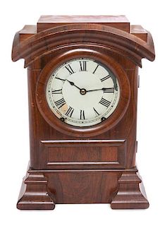 * A Victorian Mahogany Mantle Clock Height 15 1/4 inches.
