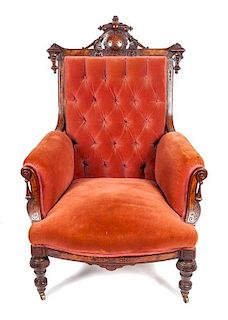 * A Victorian Walnut Armchair Height 43 inches.