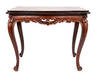 * A Louis XV Style Carved Occasional Table Height 23 1/2 x width 29 1/2 x depth 19 1/4 inches.