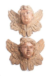 * A Pair of Painted Wooden Masks Width 13 inches.