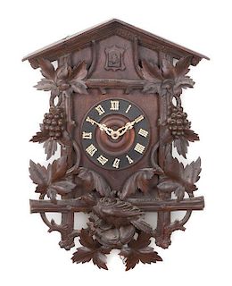* A Black Forest Style Cuckoo Clock Height 33 inches.