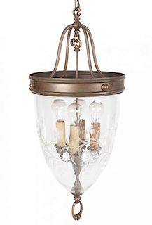 * A Brass and Etched Glass Lantern Height 35 inches.