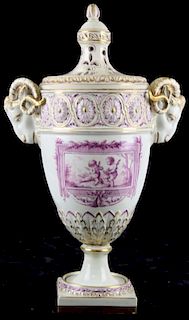18th c. Continental  soft paste porcelain garniture urn with molded rams head handles, classical fri