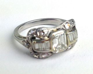 Ca 1910 platinum ladies diamond ring having stepped baguette center diamond approx. 5mm x 4.5mm flan