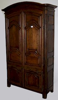 18th c French fruitwood and oak curve armoire having two raised panel arched doors over two doors. 1