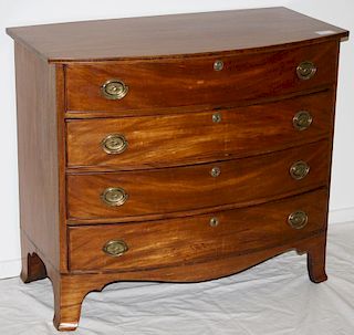 Mass Hepplewhite mahogany inlaid bow front chest of drawers having eagle brasses and flared feet. 38
