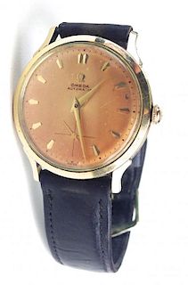 Men's Omega Automatic gold filed wrist watch with dark brown leather band. Running. 1¼" diameter fac
