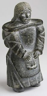 Inuit soapstone carving of a woman with mittens, signed mi a ru, ht 7.5”