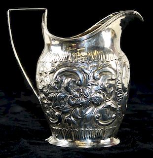 1799 English silver creamer by Andrew Fogelberg, London. Floral repousse probably reworked for 1875,