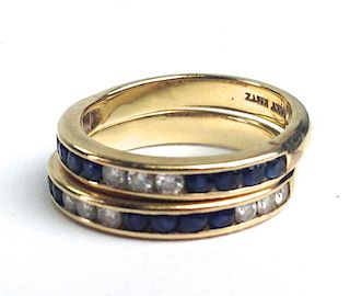 pair 14k channel set diamond and sapphire bands having 8 .02ct round sapphires and 6 .02ct round cut