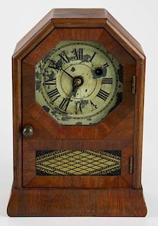 Seth Thomas rosewood veneered miniature octagon face shelf clock w/ original label, ht 9”