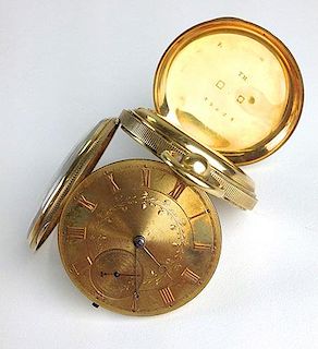 Antique 18k yellow gold pocket watch having face engraved with Roman numeral indicators and foliate,