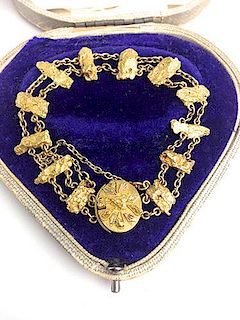 Gold nugget chain bracelet with 12 nuggets. Note " Jewelry of Annie Pickett traveling companion to P