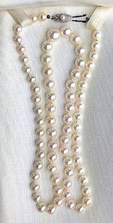 Signed Mikimoto graduated luster pearl necklace. 20"l. 5.5mm-8.5mm. Original box.