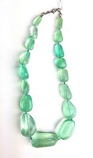 Graduated and polished aquamarine fluorite type necklace having 17 large oval stones measuring from