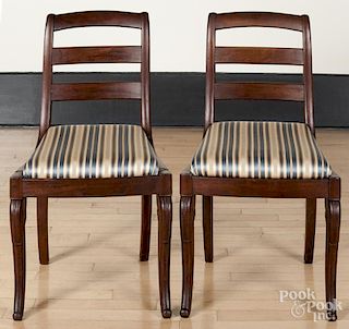 Pair of mahogany sabre leg dining chairs, 19th c.