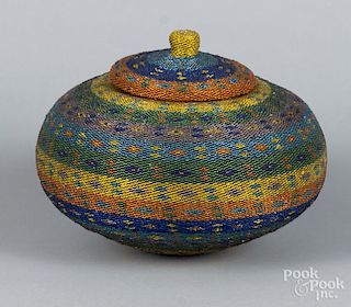 Bead wrapped woven basket with a lid, 8'' h.
