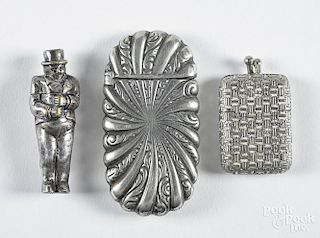 Three match vesta safes, ca. 1900, to include one of a figural gentleman in a top hat, 2 1/8'' h.