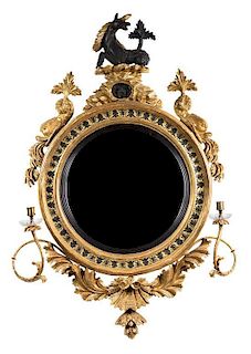 A Regency Giltwood and Ebonized Twin-Light Convex Mirror 48 x 33 inches.