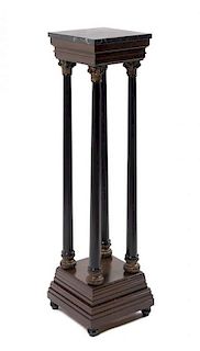 An Ebonized and Gilt Marble-Top Pedestal Height 43 7/8 inches.