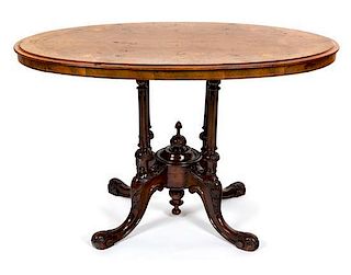 A Victorian Inlaid Walnut Center Table Height 25 1/2 x width 41 x depth 24 inches.