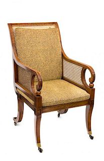 A Regency Style Painted Satinwood Library Chair Height 42 3/4 inches.