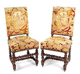 A Pair of William and Mary Style Tapestry-Upholstered Carved Oak Side Chairs Height 38 1/2 inches.