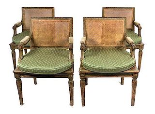 A Set of Four Louis XVI Style Green-Painted and Parcel-Gilt Fauteuils Height 32 inches.