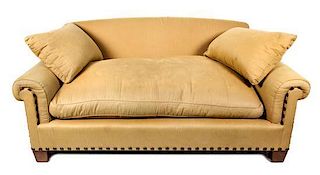 A Beige Upholstered Two-Seat Sofa Height 33 x length 76 inches.