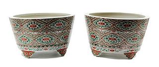 A Pair of Chinese Famille Rose Porcelain Footed Jardinières Height 10 x diameter 16 1/4 inches.