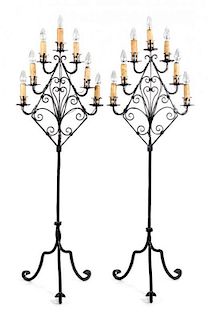 A Pair of Wrought Iron Seven-Light Floor Candelabra Height 66 1/2 inches.