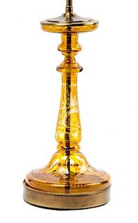 An Amber Glass Candlestick Height 14 1/4 inches.