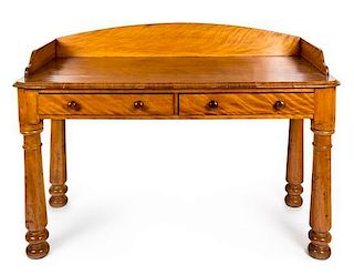 An Early Victorian Satin-Birch Dressing Table Height 34 x width 50 x depth 22 1/2 inches.