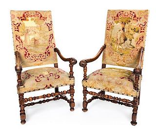 A Pair of Franco-Flemish Walnut Armchairs Height 40 inches.