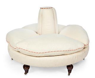A Victorian Style Mahogany and Upholstered Confidante Height 34 x diameter 58 inches.