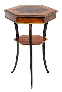 A North European Brass-Mounted Mahogany Ebonized and Burr Birch Gueridon Height 28 1/2 x width 18 inches.