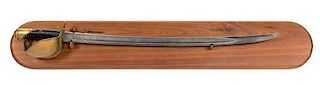A Brass and Wooden Handle Cutlass Sword on a Mahogany Backboard Length 24 inches.