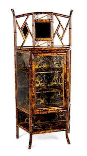 A Victorian Bamboo and Lacquered Etagere Height 64 1/2 x width 29 1/2 x depth 15 1/2 inches.