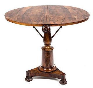 A Late Regency Rosewood Circular Side Table Height 28 1/4 x diameter 33 3/4 inches.