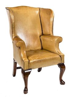 A George I Style Walnut Winged Armchair Height 54 inches.