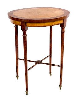 A Burr and Elm-Veneered Walnut Occasional Table Height 29 1/2 x diameter 24 inches.