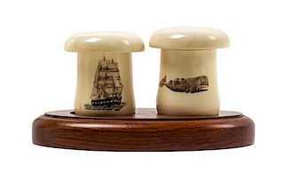 A Scrimshaw Salt and Pepper Shaker Height 2 1/4 inches.