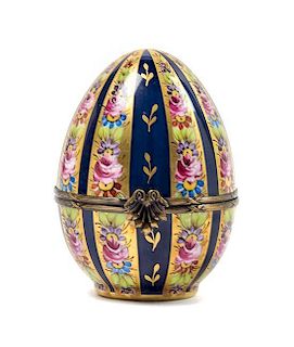 A Limoges Hand Painted Porcelain Egg-Form Box Height 4 3/4 inches.