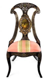 A Victorian Papier-Mache and Mother-of-Pearl Inlaid Slipper Chair Height 34 inches.